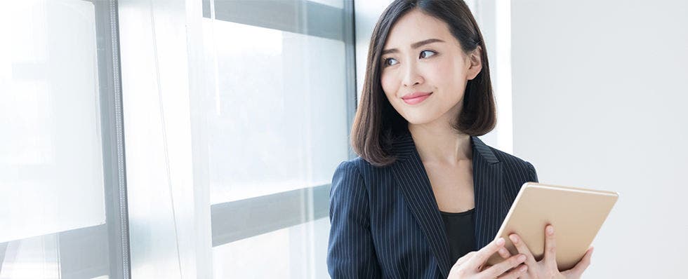 blog header image with woman holding tablet
